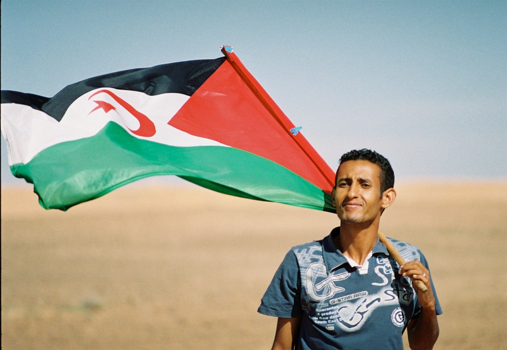 Sahrawi With Flag; accessed via Wikimedia Commons